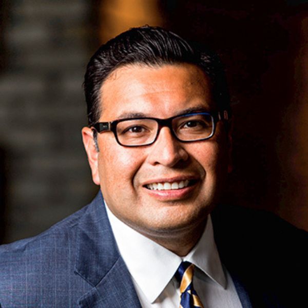 Dr. robert rodriguez headshot in suit and tie.